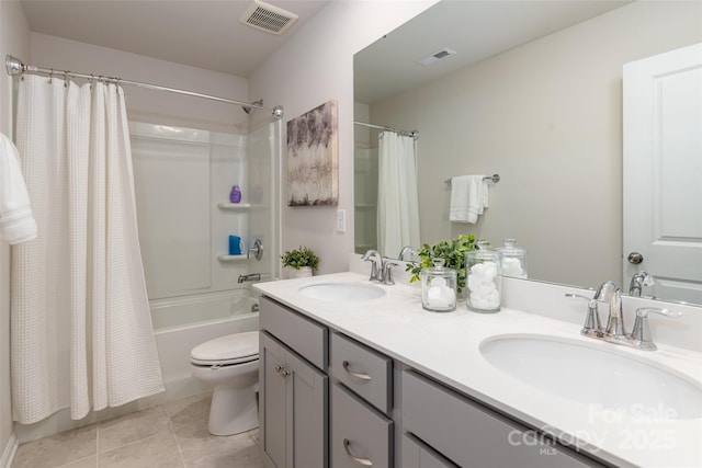 full bathroom featuring tile patterned flooring, vanity, shower / tub combo, and toilet