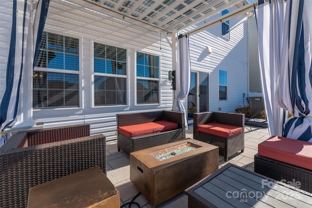 wooden terrace with a pergola, a patio area, and an outdoor living space with a fire pit