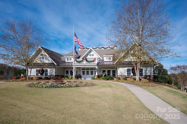 view of front of property with french doors and a front yard