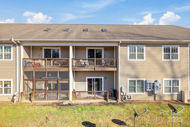 123 Foxden Dr Unit 202, Fletcher, NC 28732 - back of property featuring a balcony, a shingled roof, and a lawn