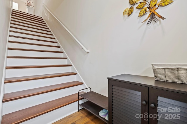 stairs with hardwood / wood-style flooring