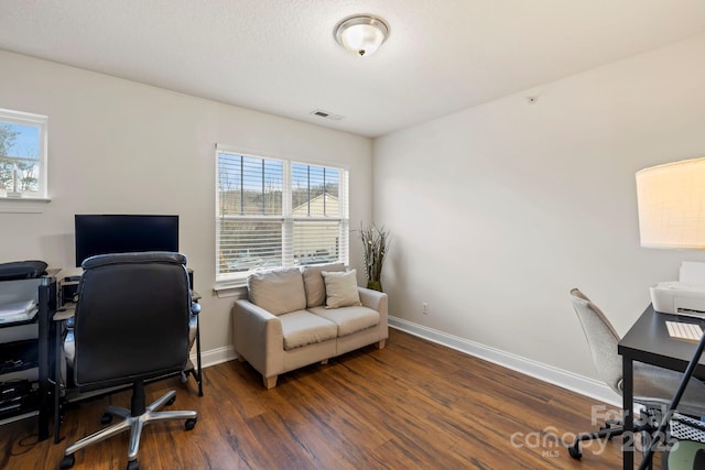 office space with dark hardwood / wood-style floors