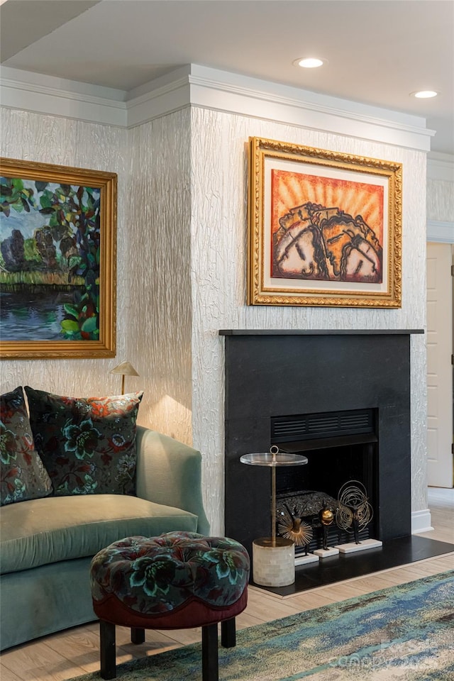 interior space with hardwood / wood-style flooring and crown molding