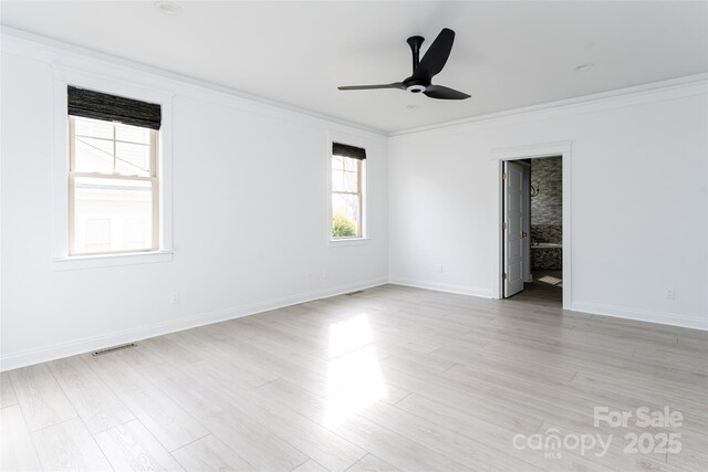 unfurnished room with ceiling fan, crown molding, and light hardwood / wood-style floors