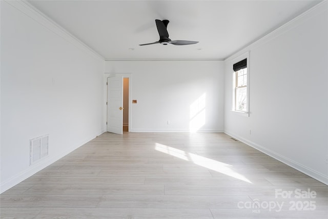 empty room with ceiling fan, light wood-type flooring, and ornamental molding