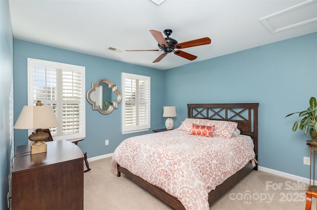 bedroom with ceiling fan and light colored carpet