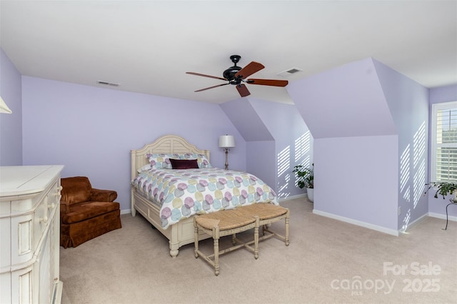 bedroom featuring ceiling fan, light colored carpet, and vaulted ceiling