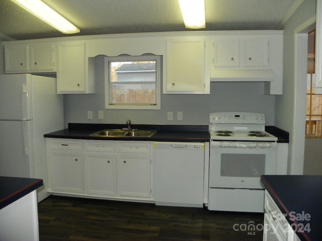 kitchen featuring sink, white cabinets, dark wood-type flooring, and white appliances