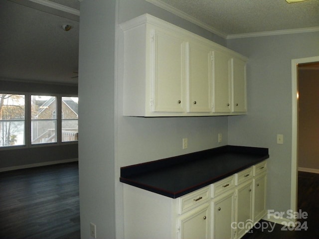 kitchen with white cabinets and ornamental molding