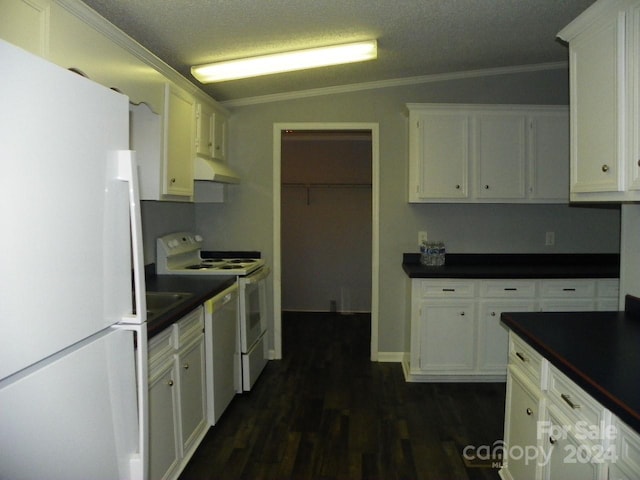 kitchen with lofted ceiling, white cabinetry, dark wood-type flooring, and white appliances