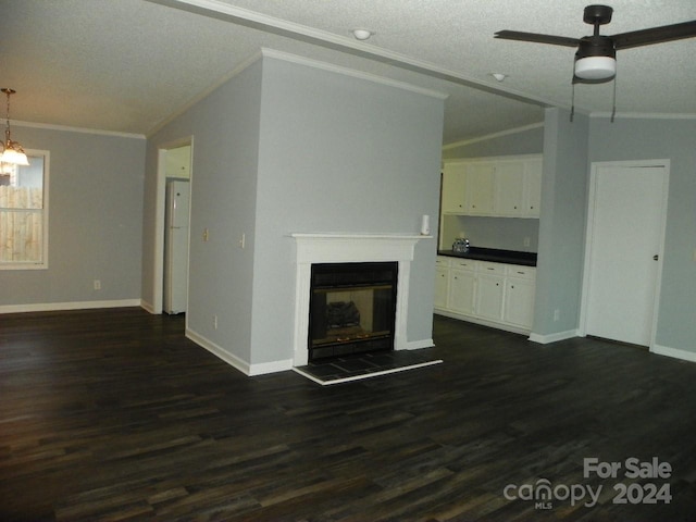 unfurnished living room featuring ceiling fan, ornamental molding, a fireplace, and vaulted ceiling