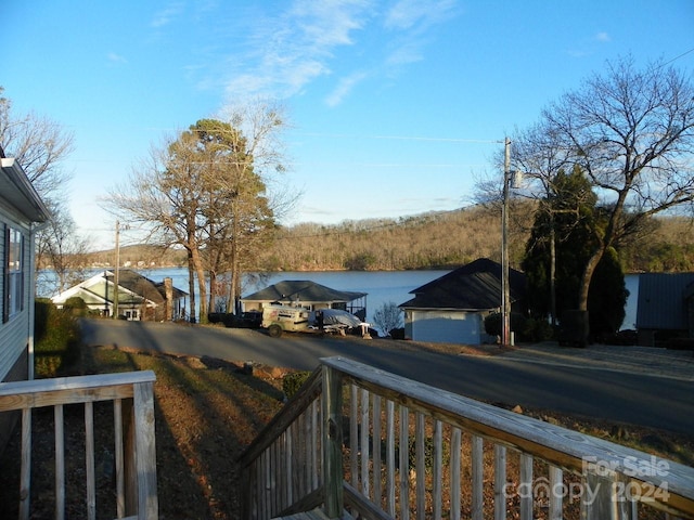 exterior space featuring a water view and a carport