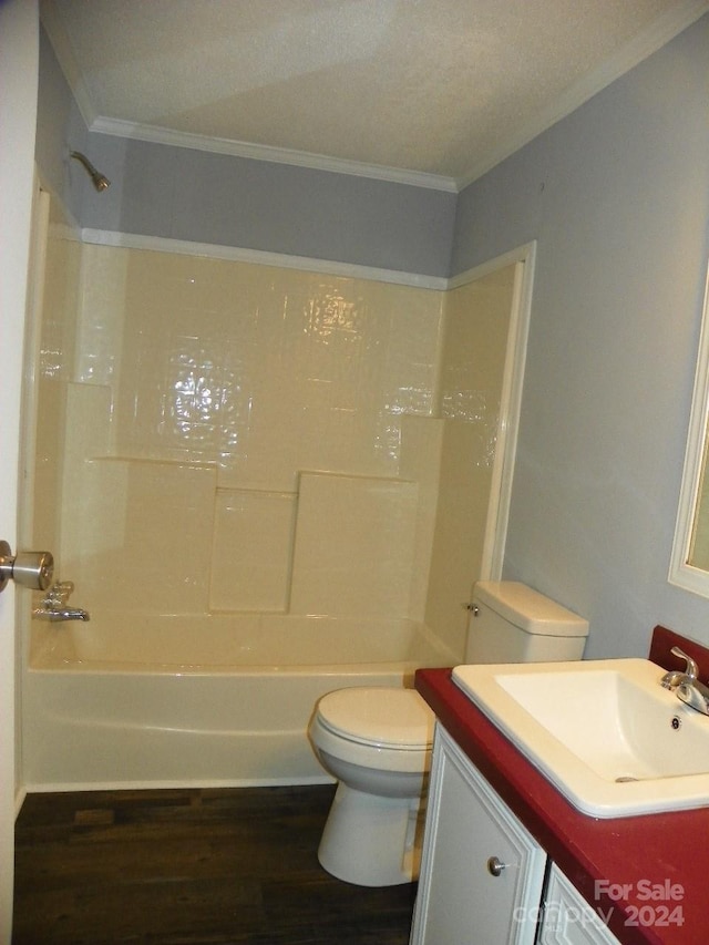 full bathroom with shower / bath combination, ornamental molding, vanity, wood-type flooring, and toilet