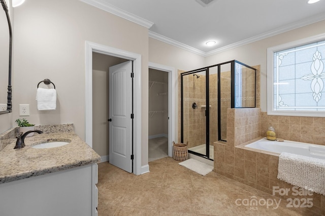 bathroom featuring vanity, tile patterned flooring, plus walk in shower, and ornamental molding