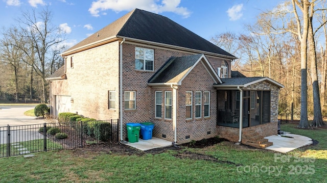 rear view of property with a sunroom and a yard