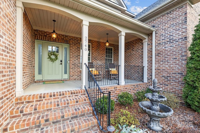 doorway to property featuring covered porch