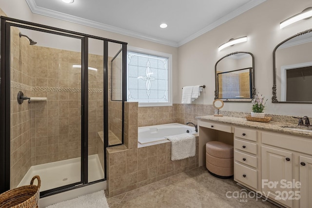 bathroom featuring tile patterned floors, vanity, crown molding, and independent shower and bath