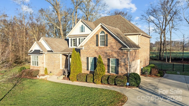 view of front property with a garage and a front lawn