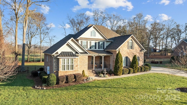 view of front facade featuring a front lawn and a porch