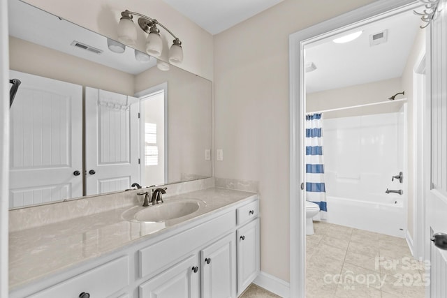 full bathroom with tile patterned floors, vanity, toilet, and shower / bath combo with shower curtain