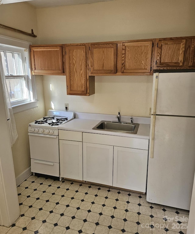 kitchen with sink and white appliances