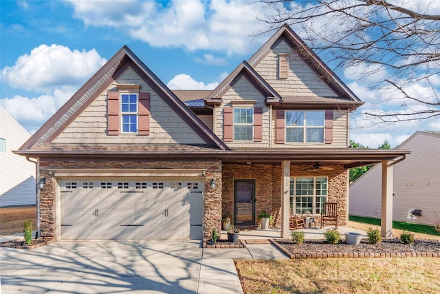 craftsman-style house featuring a porch and a garage