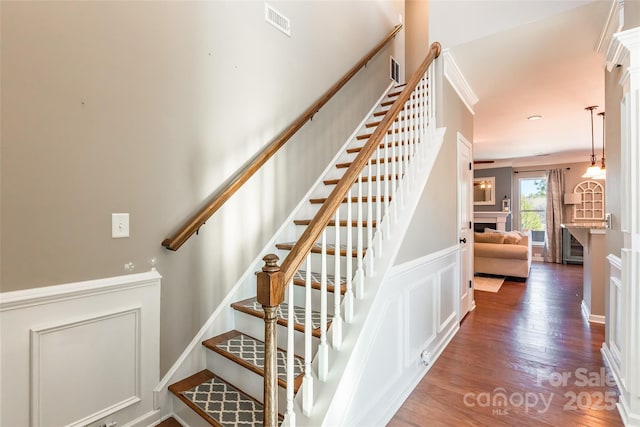 stairs featuring wood-type flooring