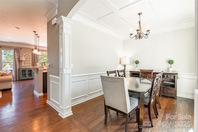 dining space featuring ornate columns, coffered ceiling, dark hardwood / wood-style flooring, a notable chandelier, and crown molding