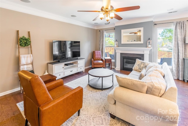 living room featuring ceiling fan, hardwood / wood-style floors, and ornamental molding