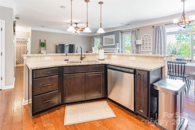 kitchen with dark brown cabinets, stainless steel dishwasher, and pendant lighting