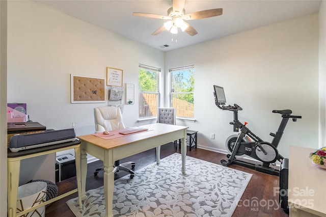 office with ceiling fan and dark wood-type flooring