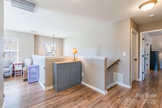 hall with light wood-type flooring