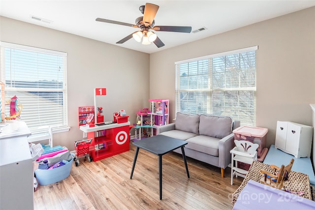 game room featuring hardwood / wood-style floors and ceiling fan