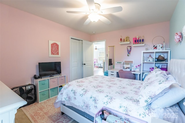 bedroom featuring carpet flooring, ceiling fan, and a closet