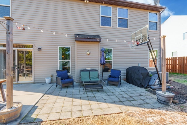 back of house featuring cooling unit and a patio area