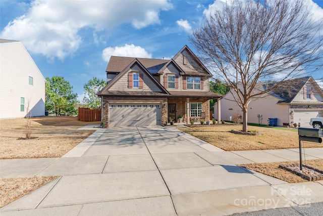 view of front of property with a garage and a front lawn