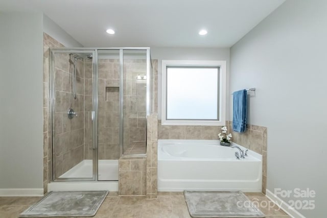 bathroom with shower with separate bathtub