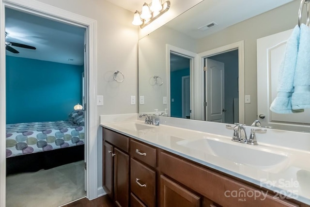 bathroom featuring ceiling fan, vanity, and hardwood / wood-style flooring