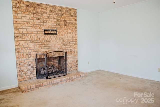 unfurnished living room featuring a fireplace and carpet floors