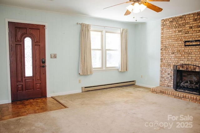 carpeted entrance foyer with ceiling fan, a baseboard radiator, and a brick fireplace