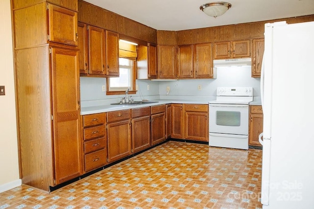 kitchen with white appliances and sink