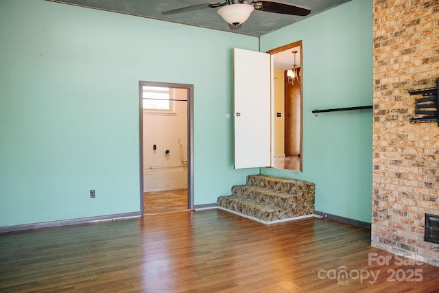 spare room featuring ceiling fan and hardwood / wood-style flooring