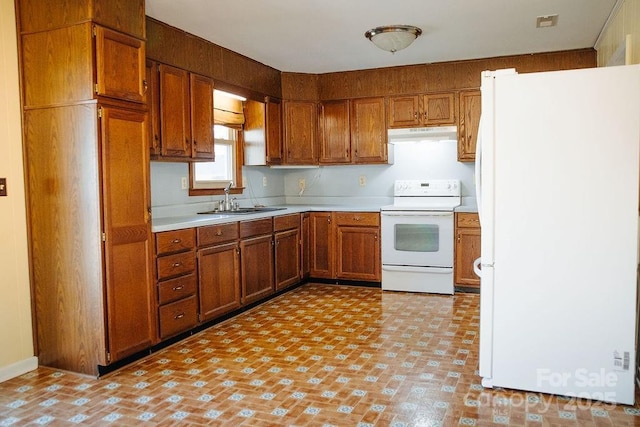 kitchen featuring white appliances and sink