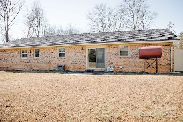 rear view of house with central AC