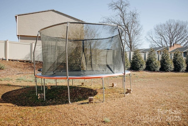 view of jungle gym with a trampoline