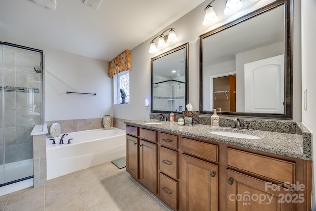 bathroom featuring tile patterned floors, vanity, and plus walk in shower