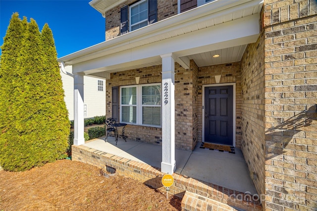 doorway to property with covered porch