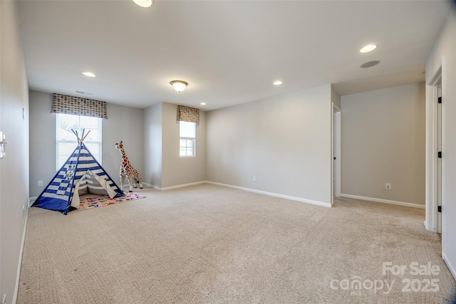 playroom featuring a healthy amount of sunlight and light colored carpet