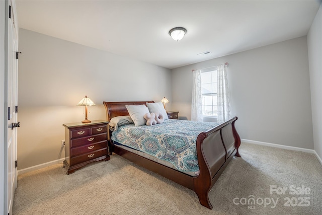 bedroom with light colored carpet