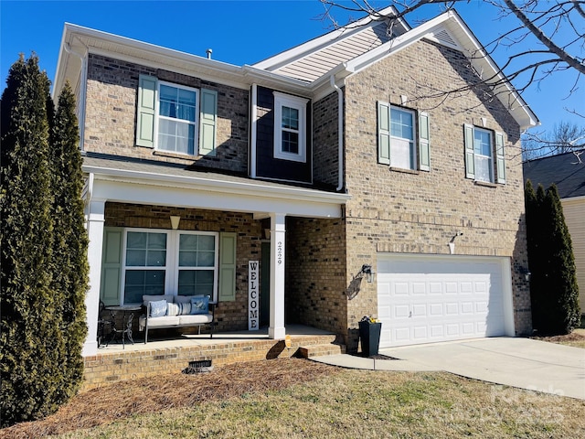 view of front of property featuring a porch and a garage